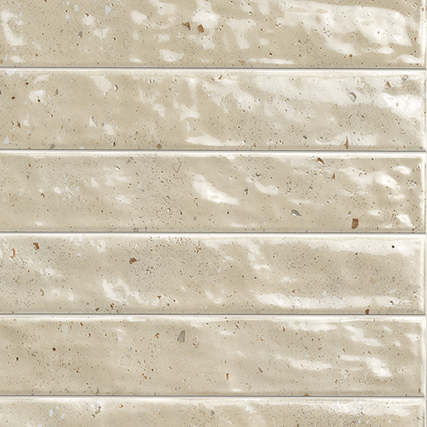 Via Del Sale - Sand tiles: beige, rectangular ceramic tiles featuring a glossy finish, subtle speckles, and gently uneven surfaces, arranged in a horizontal stacked pattern.