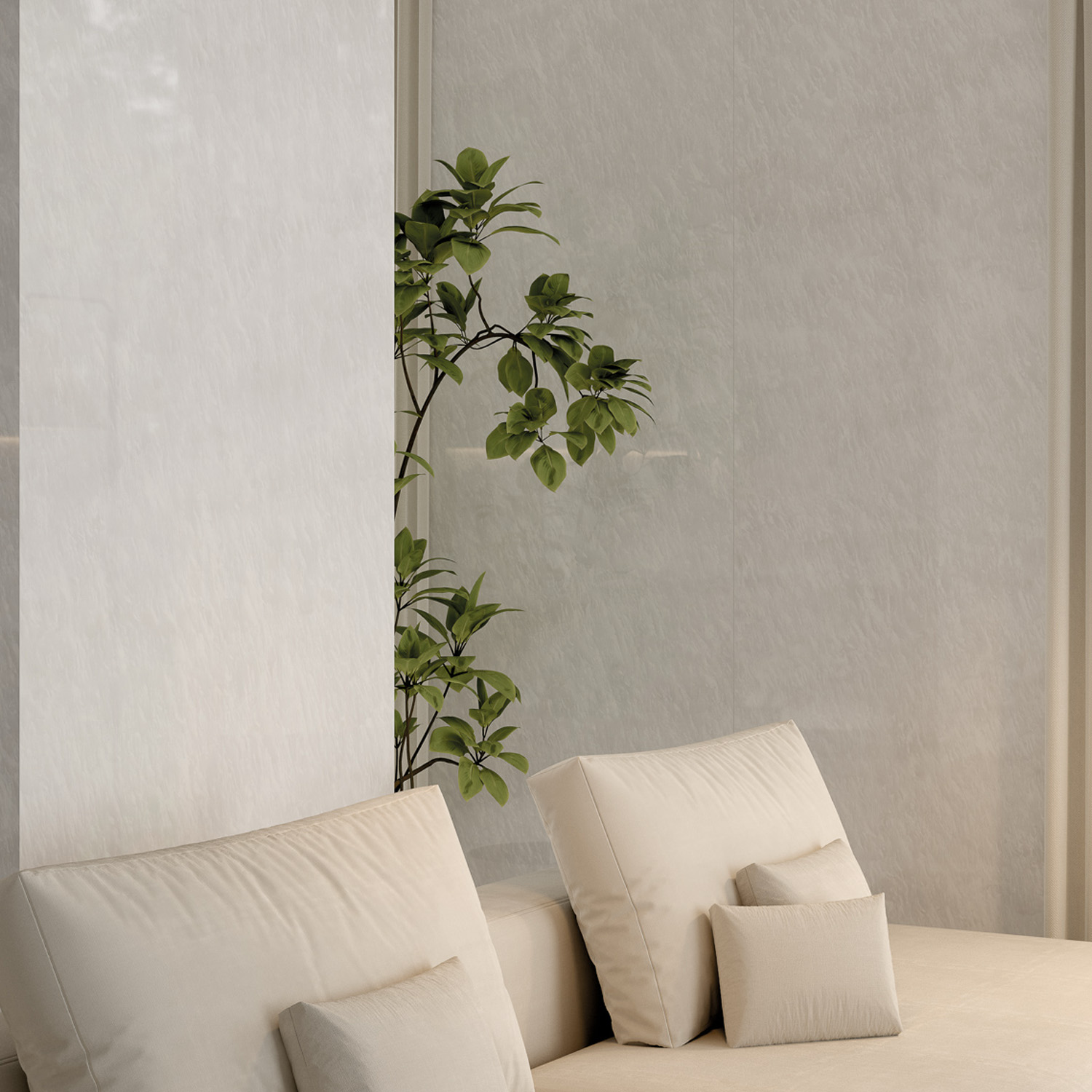 Minimalist living room featuring the Afyon Bianco sofa adorned with light beige cushions and small matching pillows, complemented by a green leafy plant behind and large windows draped with sheer curtains that let in soft natural light.